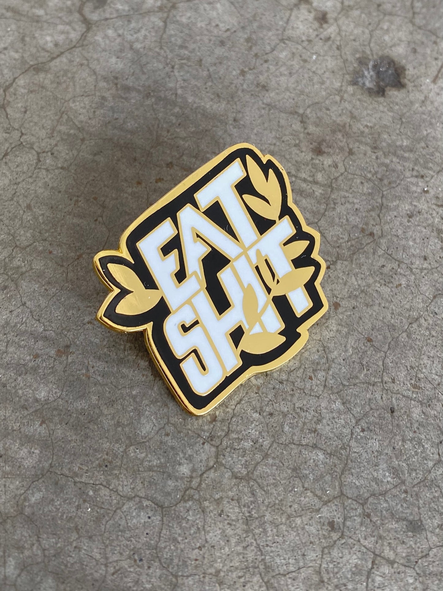 EAT SHIT enamel pin