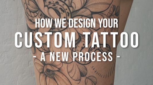 Custom blackwork floral tattoo featuring flowers and a snake, representing the collaborative tattoo design process at Lu Loram-Martin's private Toronto tattoo studio.