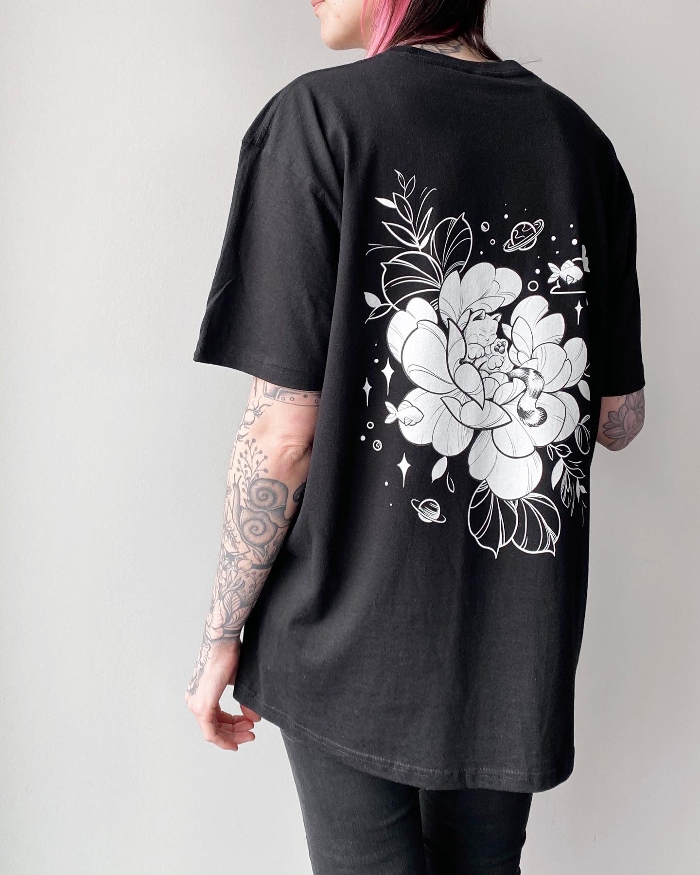 Always dreaming cat and flower tshirt design in black line work and shading, illustrated by female floral tattoo artist Lu Loram Martin, Toronto, Canada