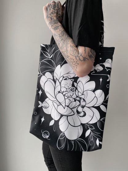 Always dreaming cat and flower tote design in black line work and shading, illustrated by female floral tattoo artist Lu Loram Martin, Toronto, Canada