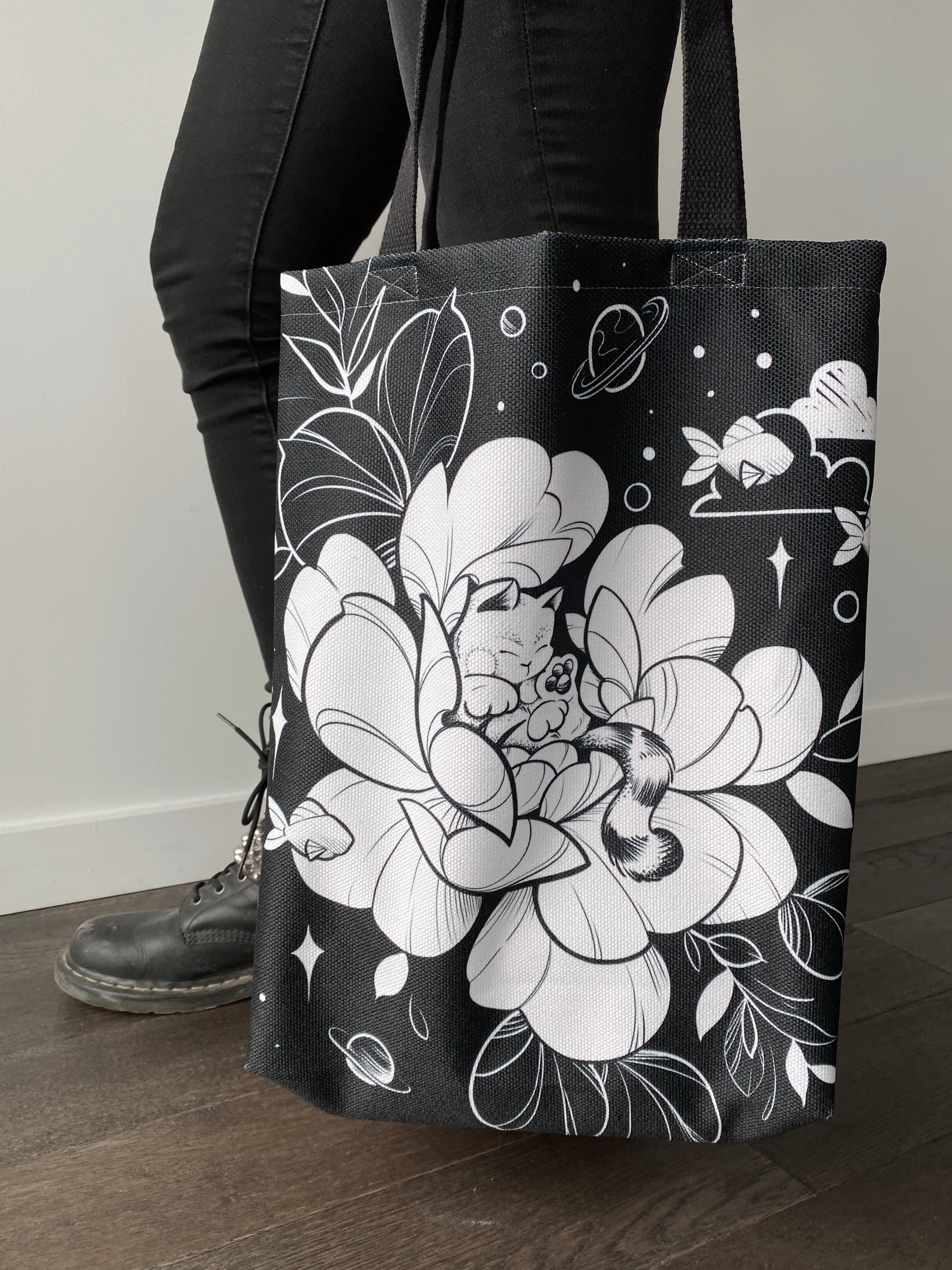Always dreaming cat and flower tote design in black line work and shading, illustrated by female floral tattoo artist Lu Loram Martin, Toronto, Canada