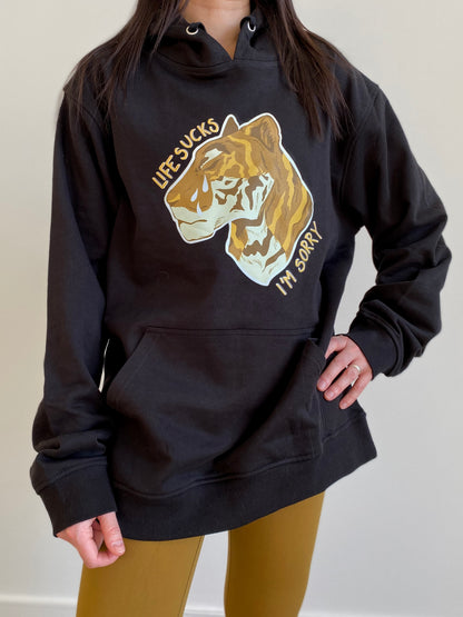 "Life sucks, I'm sorry" gold tiger design on black hoodie designed and illustrated by floral tattoo artist Lu Loram Martin, in Toronto, Canada.